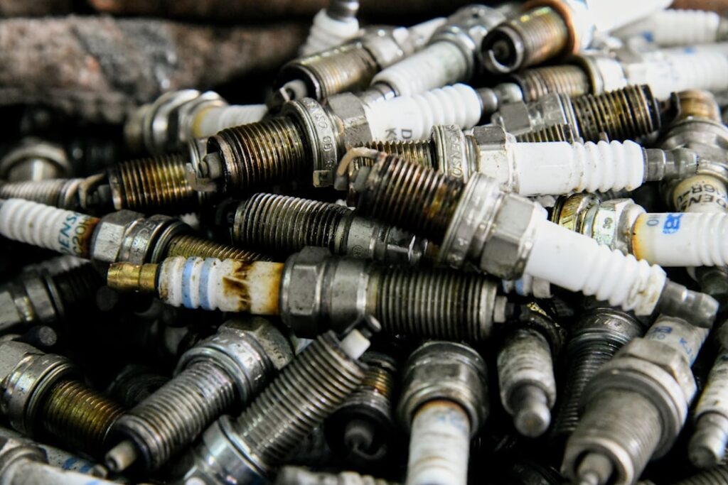I captured a pile of old spark plugs in a mechanics repair shop.